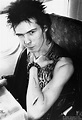 Sid Vicious of The Sex Pistols with cut arm on plane during US Tour ...