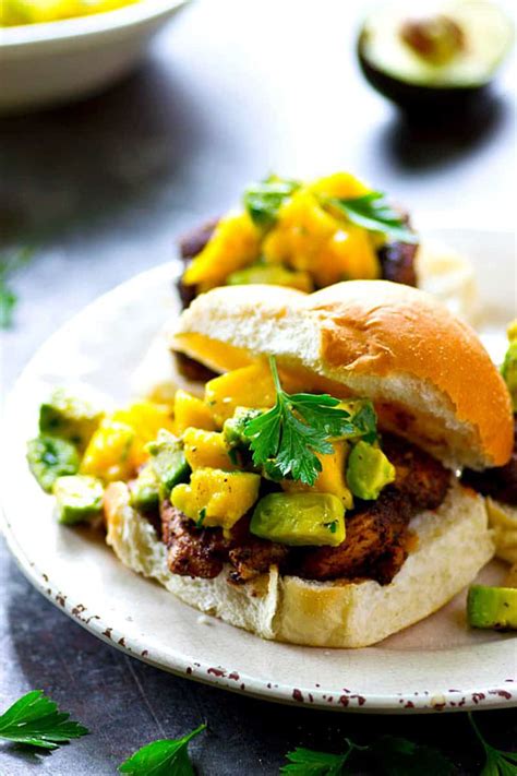 Grilled mango chicken is a delicious tropical dinner with a dynamo citrus marinade topped with an easy mango salsa for simple spa dining at home. Grilled Blackened Chicken Sandwiches with Mango Avocado Salsa