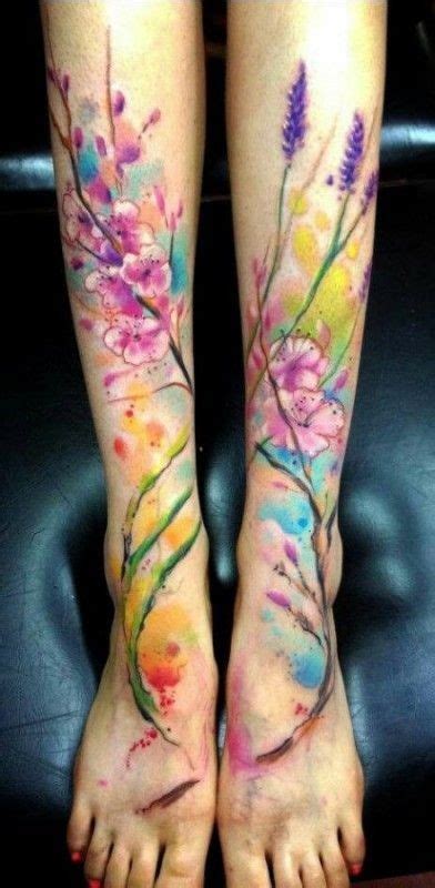 Nice Watercolor Flowers Tattoo On Feet By Adam Kremer Foot Tattoo