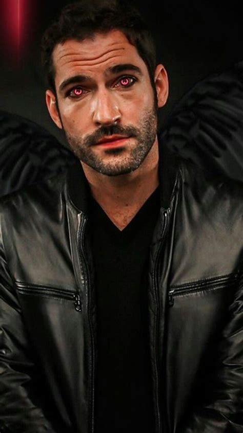 A Man Wearing A Black Leather Jacket And Red Eyes