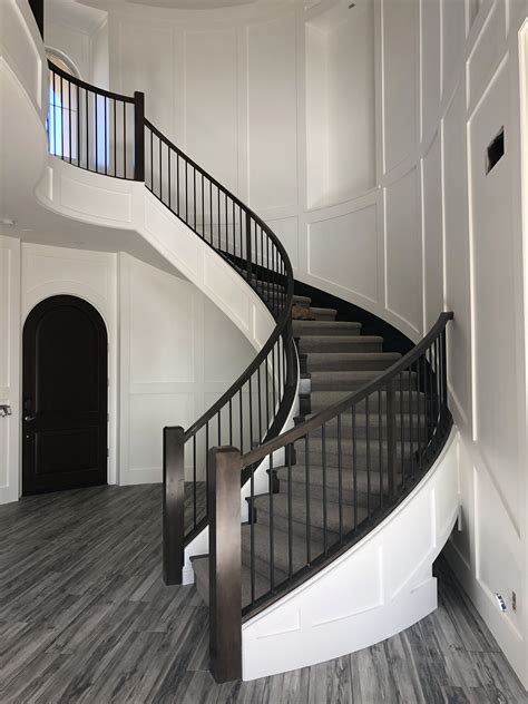 Contemporary Wainscot With Round Staircase Entryway Stairs Foyer