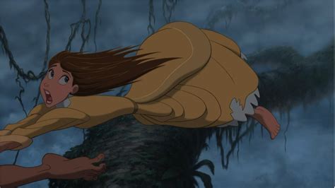 jane being dragged by tarzan in the air to make an escape tarzan and jane tarzan disney films