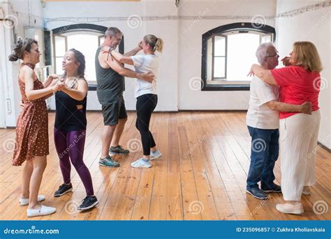 Joyful Caucasian Seniors Learning Couple Dance Moves Stock Image