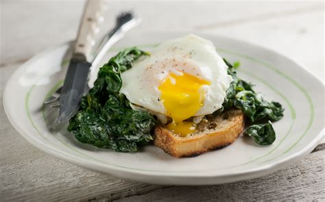 Place the bread slices on a baking sheet and spread with the softened butter and equal amounts cheese mixture. Eggs Florentine with Goat Cheese - Framed Cooks