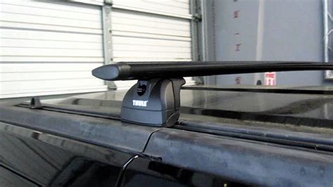 Hummer H3 With Thule Rapid Podium Black Aeroblade Base Roof Rack By