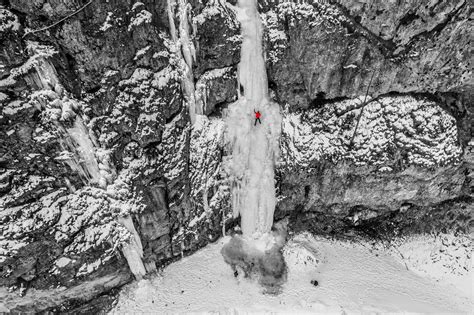 Ice Climbing In The Iced Waterfall Cascata Di Cambrembo Italian Alps
