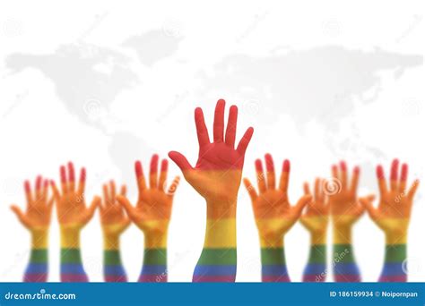 Lgbt Equal Rights Movement And Gender Equality Concept With Rainbow Flag On People S Hands Up