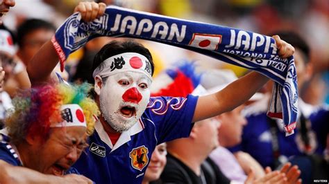 World Cup Japan Fans Impress By Cleaning Up Stadium Bbc News