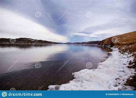 Lake Baikal In December Snow On The Shore Clear Calm Water Stock
