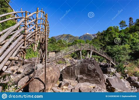 Traditional Bamboo Bridge For Crossing Mountain River At Forest At