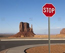 Stop Sign and Mesa in the Desert stock photo - OFFSET