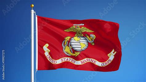 united states marine corps flag waving against clean blue sky close up isolated with clipping