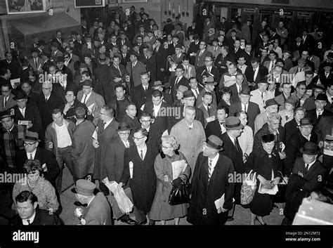 Stranded commuters crowd the waiting area of the Long Island Railroad