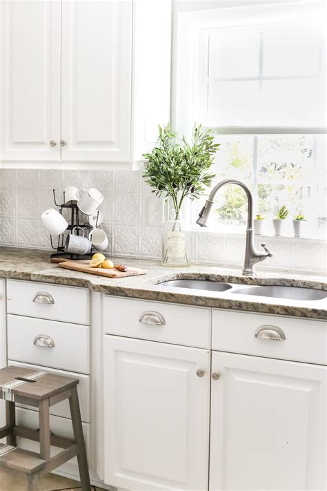 Looking for an easy and cheap way to add style to your kitchen island? DIY Pressed Tin Kitchen Backsplash - Bless'er House