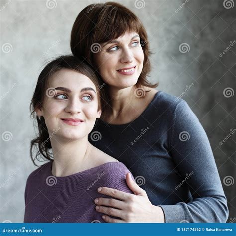 Happy Senior Mother Embracing Adult Daughter Laughing Together Older Lady Hugging Young Woman