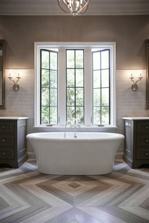Textured finishes and graphic mosaic patterns are trending among tiling ideas for bathrooms. Bathroom idea | Herringbone tile floors, Floor design ...