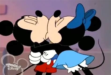 Mickey And Minnie Kissing In Front Of A Purple Background