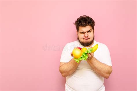 Positive Fat Man With Funny Face Isolated On Pink Background With