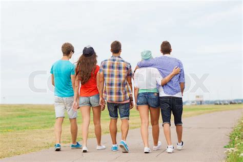 Group Of Teenagers Walking Outdoors From Back Stock Image Colourbox