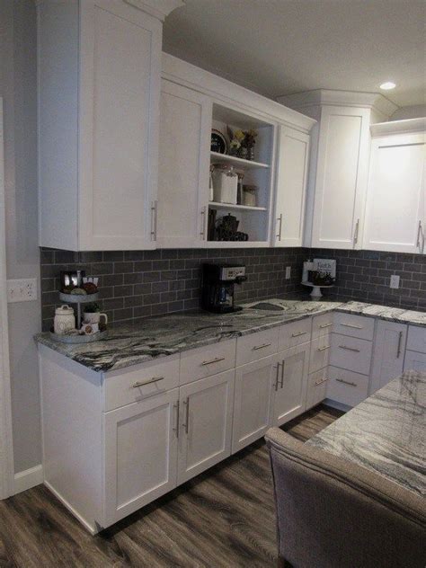 White Shaker Cabinets Paired With A Gray Island Viscount White Granite