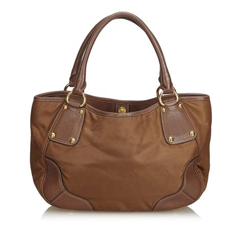 Sale on backpacks, laptop bags & accessories. Prada Brown Fabric Nylon Tote Bag For Sale at 1stdibs