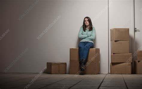 Teenage Girl Sitting On Cardboard Box Stock Image F0057484