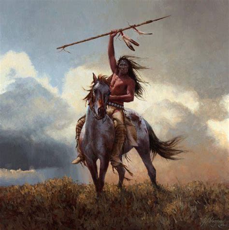 A Native American Man Riding On The Back Of A White Horse Holding A