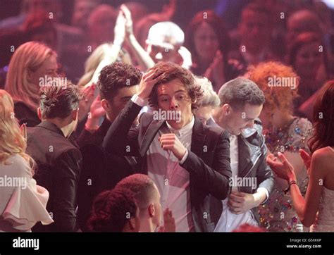 Harry Styles Celebrates As One Direction Win The Global Success Award During The 2013 Brit