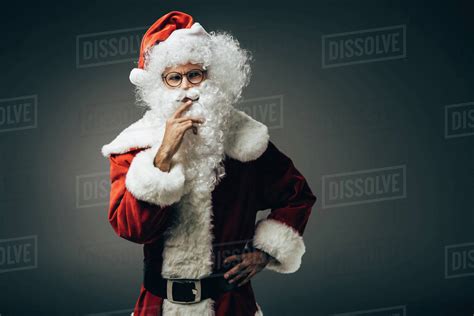 Thoughtful Santa Claus In Costume Holding Hand Near Mouth Isolated On
