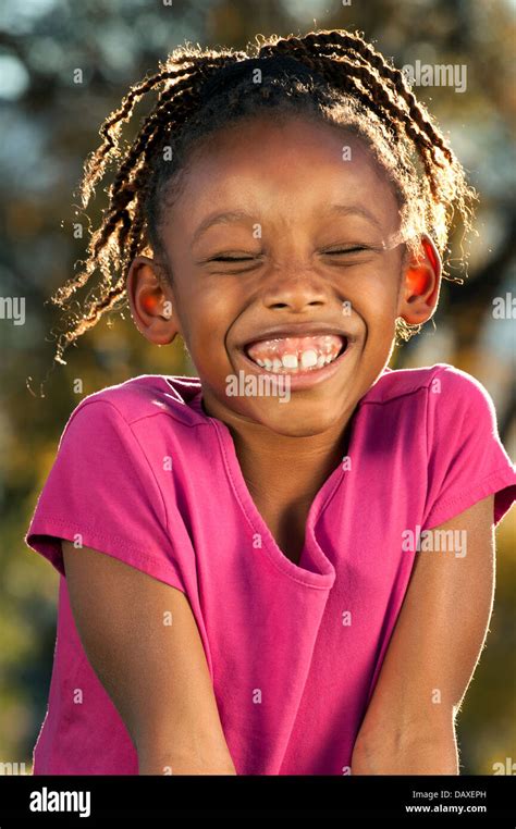 Young African American Girl Enjoying Nice Sunny Day In A Park Stock