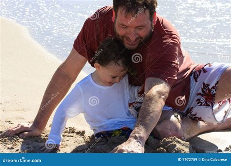 Dad And Son Playing At The Beach Royalty Free Stock Images Image