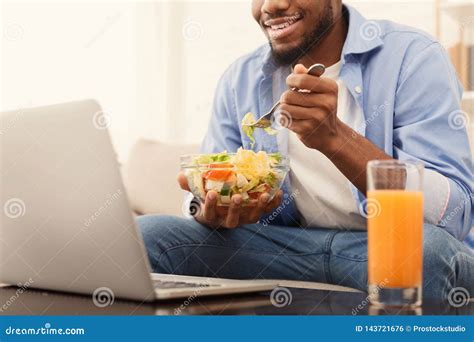 Cheerful African American Man Eating Healthy Lunch At Home Stock Photo