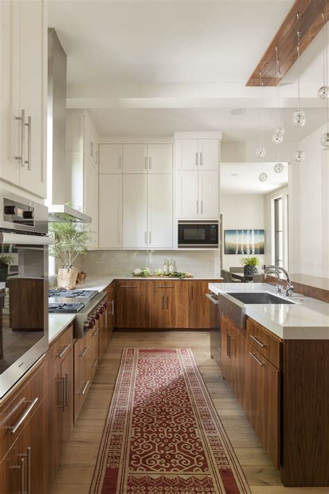 Walnut base cabinets in the kitchen are finished with tung oil to