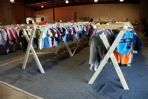Even if you have to fake a clothing rack with a sawhorse, do it. Image result for ideas for hanging a clothesline in the garage for a garage sale | Yard sale diy ...