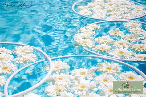 Floating flower centerpieces floating flowers backyard wedding pool garden pool do it yourself wedding outdoor wedding decorations pink flowers having a wedding in your backyard near the pool? Rings with flowers floating in a pool | Floating flowers ...