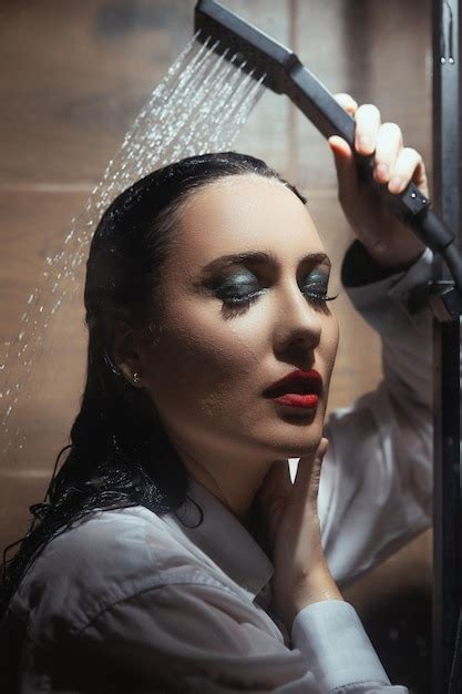 Premium Photo A Woman Is Showering In A Shower With A Shower Head