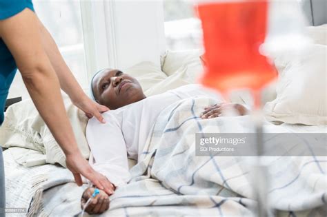 Hospice Nurse Checks On Senior Female Patient High Res Stock Photo