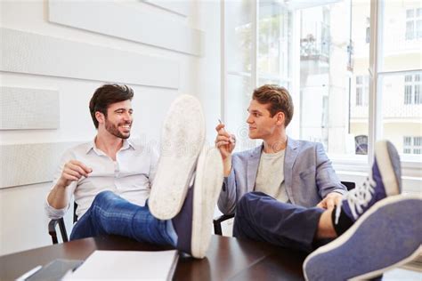 Two Young Men Talking With Each Other Stock Photo Image Of Planning