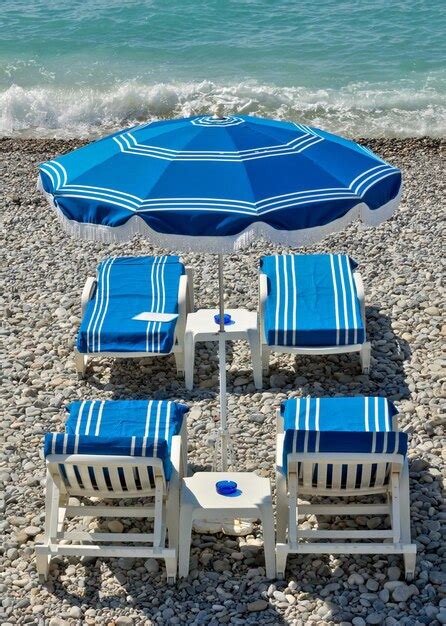 Premium Photo City Of Nice Beach With Umbrella