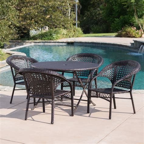 Outdoor 5 Piece Wicker Dining Set With Foldable Table And Stacking