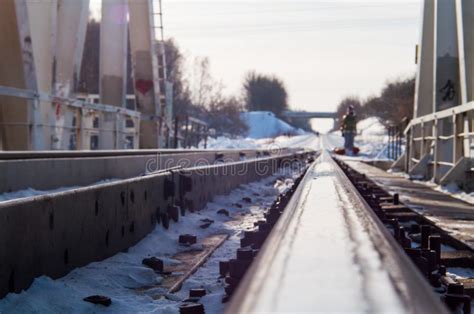 Winter Landscape With Railroad Bridge Over Frozen River Snow Covered