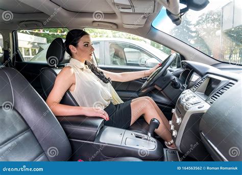 Beautiful Woman Sitting In Driver Seat Inside Car Stock Photo Image