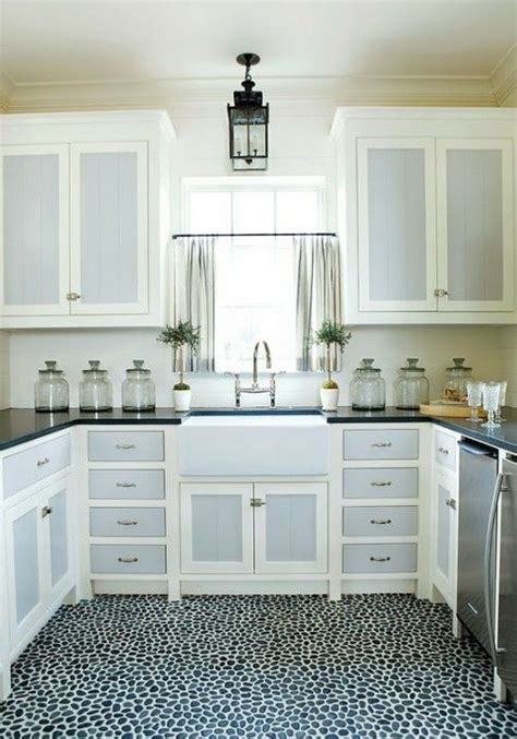 A sleek row of white cabinets on top provide a visual respite. two color cabinets | Kitchen | Pinterest