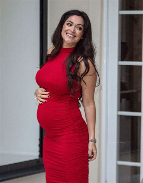 Casey Batchelor Shows Off Her Baby Bump In A Red Dress Photos