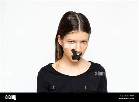 Girl With Her Mouth Sealed Over Isolated Background Keep Quiet And Don