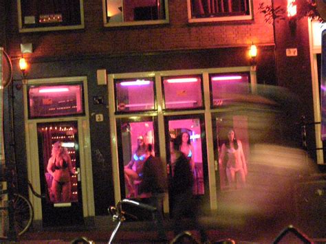 red light district amsterdam working girls in the red win… flickr