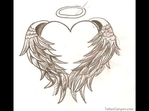 Angel wings are one of the most recommended memorial tattoos. heart tattoos with wings small | 8245-heart-amp-angel ...