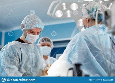 Team Surgeon At Work In Operating Room Stock Photo Image Of Doctor