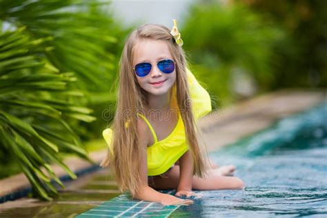 Cute Girl In Sunglasses In The Swimming Pool Outdoors Stock Photo Image Of Happy Eyes