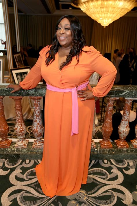 check out loni love s curvaceous figure in a green leather jacket with matching skirt